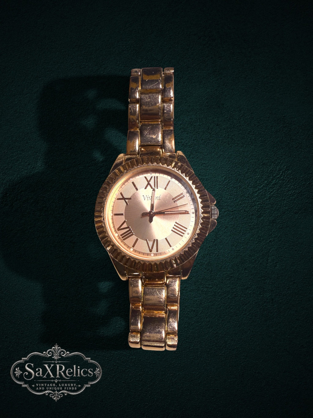 My Store Vivani gold-tone wristwatch with a fluted bezel, Roman numeral dial, and polished metal link bracelet.