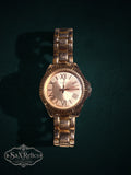 My Store Vivani gold-tone wristwatch with a fluted bezel, Roman numeral dial, and polished metal link bracelet.