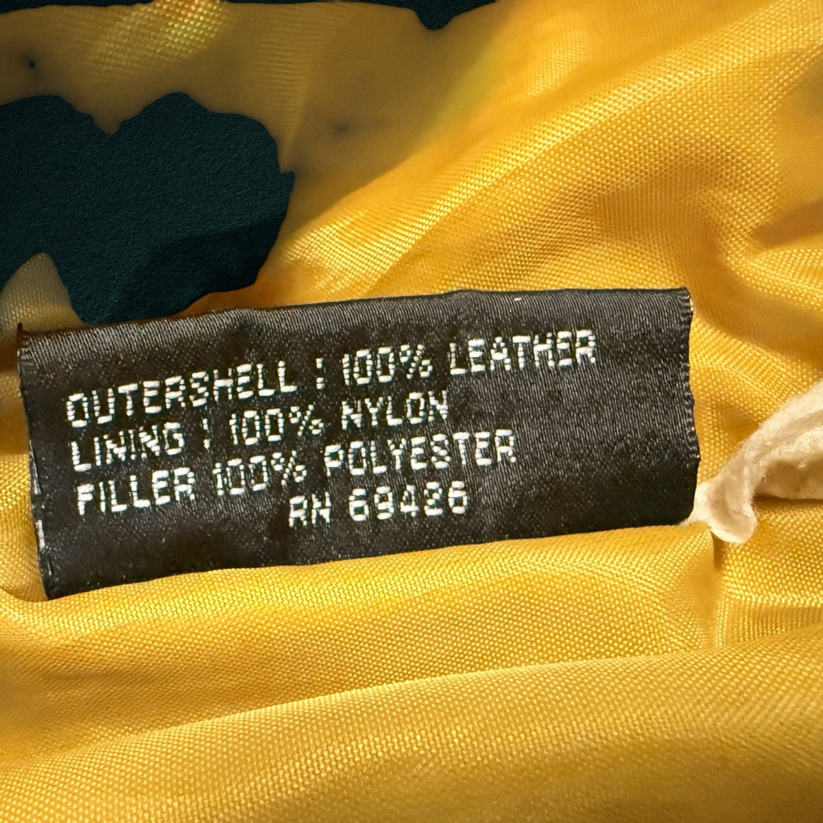 My Store Wilsons The Leather Experts jacket care label showing 100 percent leather shell and nylon lining
